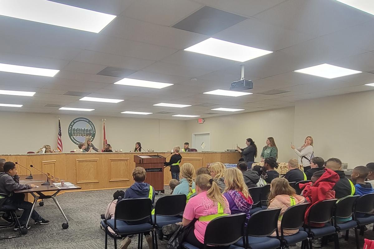 The 5th graders participating in a mock election and commission meeting